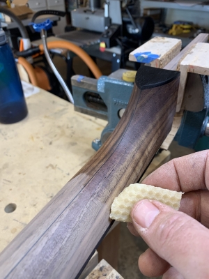 Applying a beeswax finish to a walnut neck