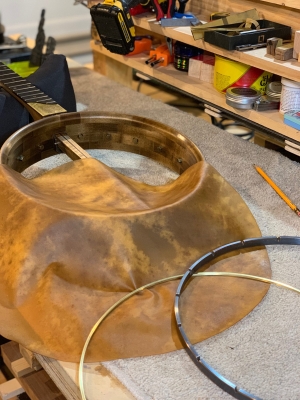 Mounting a coffee-stained goatskin head